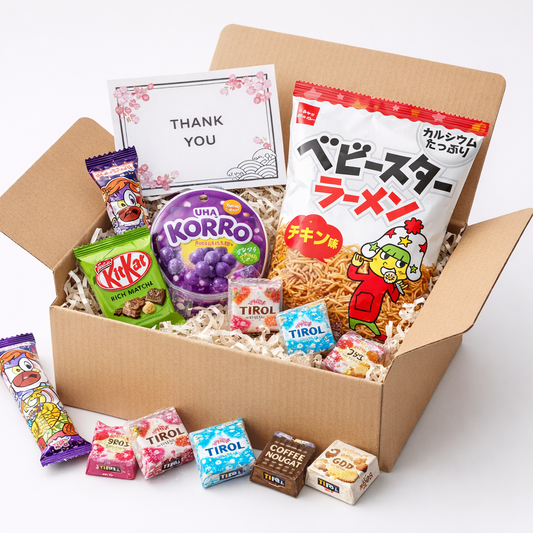 Japanese snack set in a gift box with KitKat, gummy candy, Tirol chocolate, Umaibo, and Baby Star ramen, shipped from Japan