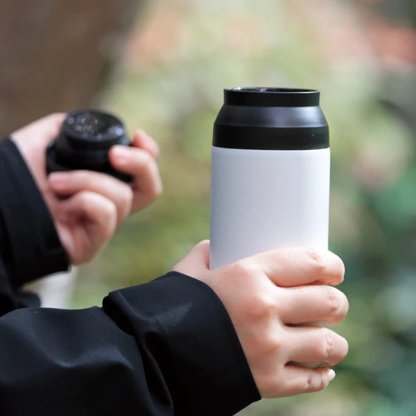 Hand holding a Japanese stainless steel bottle